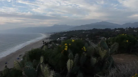 Pan from Beach to Sunset over the Ocean Stock-Footage 46667703