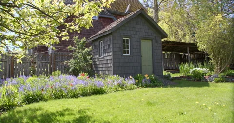Pan of beautiful backyard in spring Stock Footage 220913753