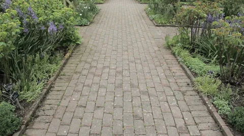 Pan up of beautiful garden path Stock Footage 38871747