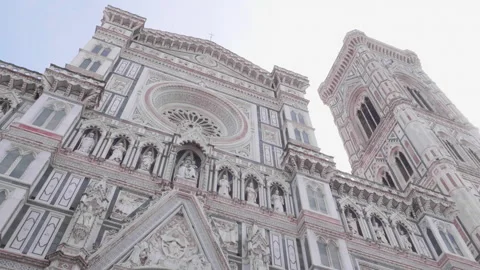 Pan from below of front exterior of Santa Maria del Fiore, Florence, Italy Stock Footage 307554528