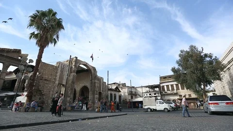 Pan between Umayyad Mosque and facing Grand Bazaar of Damascus, Damascus, Syria Stock Footage 119498631