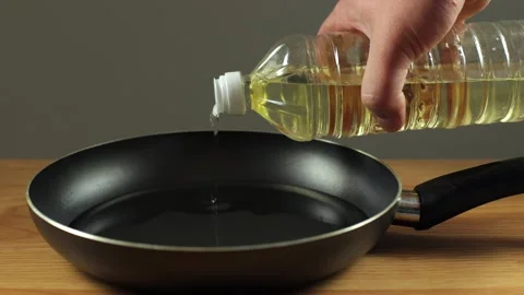 The pan is black on the table. A frying pan Stock Footage 273286899