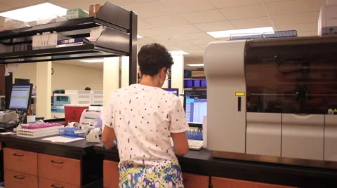 Pan of Blood lab with tech Video stock 53880577