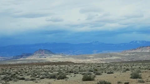 Pan-Blue distant mountains-Desert panorama Stock Footage 243840186