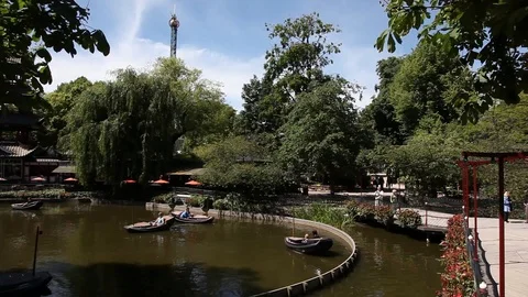 Pan of boat rides in theme park Stock Footage 89588254