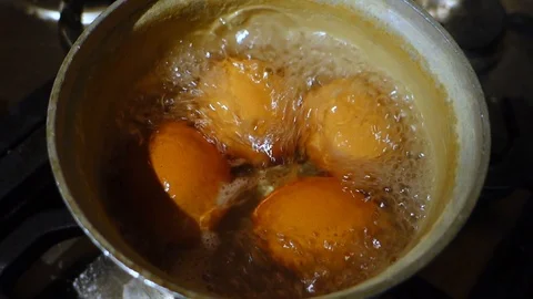 Pan of boiling eggs Stock Footage 122329917