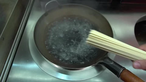 Pan With Boiling Udon Noodles. Throwing Pasta Into Boiling Water Stock Footage 159508559