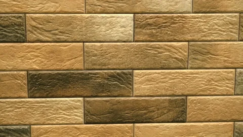 Pan of brown decorative seamless brick home. Brickwork background. Figure block Stock Footage 99175181
