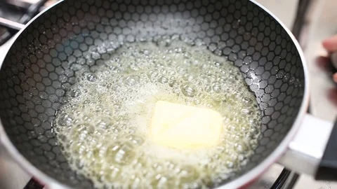 Pan with butter Frying Stock Footage 110809811