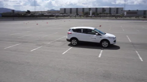 Pan of Car Driving on Test Track Vidéo 57220576