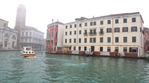 Pan from channel to historical building Stock Footage