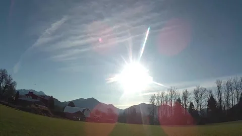 Pan Chemtrail Sun Rays W to E Stock Footage 145383704