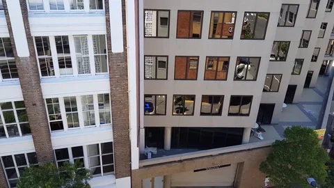 Pan to city intersection then up to buildings Stock Footage 82754163