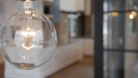 Pan of clear interior large, globe light in modern home. Stock Footage 98013782
