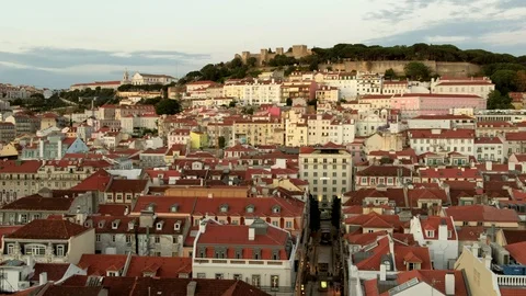 Pan clip across the rooftops of central Lisbon at sunset Stock Footage 119764645