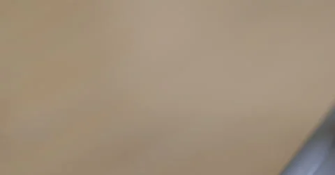 Pan to a close up of a hole drilled through a hard drive 4K Stock Footage 68657390