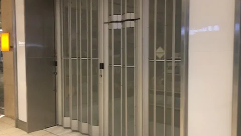 Pan of closed mall shops during pandemic in Toronto Stock Footage 127851779