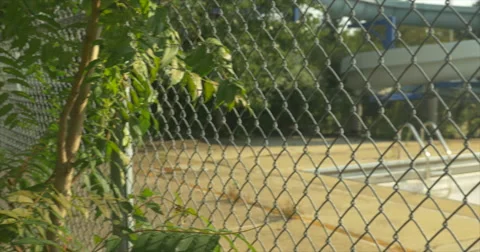 Pan of closed pool with water slide Stock Footage 42108138