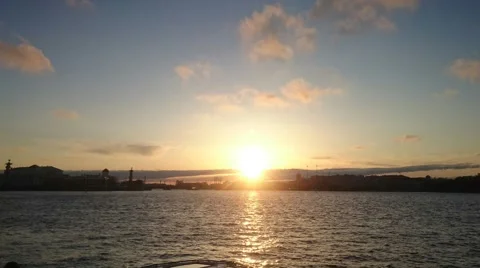 Pan clouds time lapse. Sunset at embankment of the Neva river. Saint-Petersbourg Stock Footage