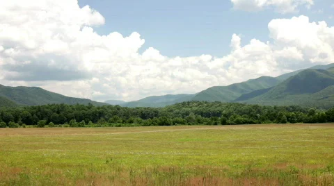 Pan of Cloudy Mountain and Field Video stock 773339