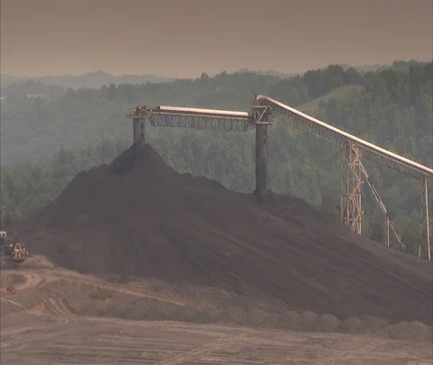Pan of coal pile and conveyor at Century Mine Stock Footage 86696068
