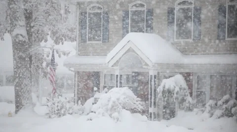 Pan up to colonial house in the snow Stock Footage