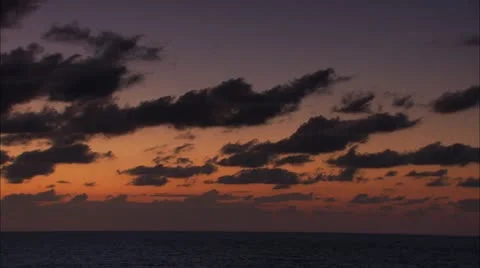 Pan of a colorful cloudy skyline Stock Footage 12761367