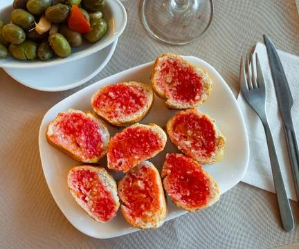 Pan con tomate - grilled bread topped with mixture of grated tomatoes with salt Stock Photos