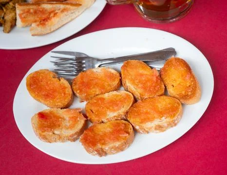 Pan con tomate - grilled bread topped with mixture of grated tomatoes with salt Stock Photos