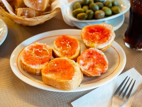 Pan con tomate - grilled bread topped with mixture of grated tomatoes with salt Stock Photos