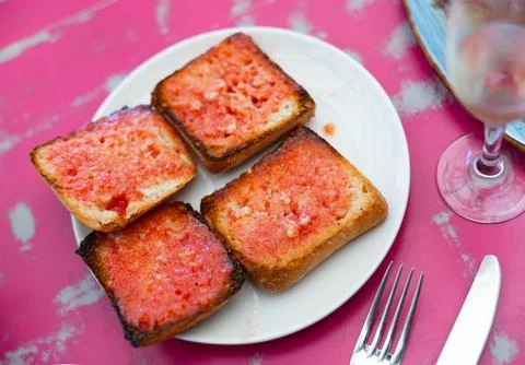 Pan con tomate - grilled bread topped with mixture of grated tomatoes with salt Stock Photos