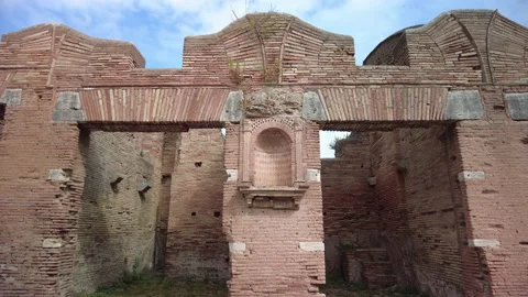 Pan up on the courtyard wall of the Casa del Larario, Ostia Antica, Rome Stock Footage 160737560