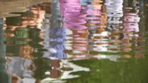 Pan of crowd reflections in water Stock Footage 8912126