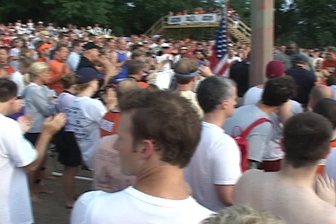 Pan of crowd at start area of triathlon swim event Stock Footage 125448384