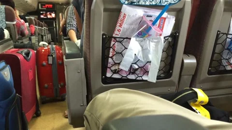 Pan of crowded train with luggage Stock Footage 50561354