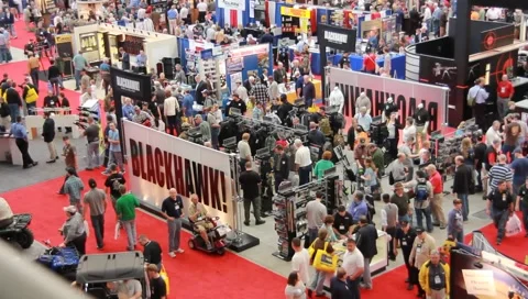 Pan of crowds at gun show(HD)c Stock Footage