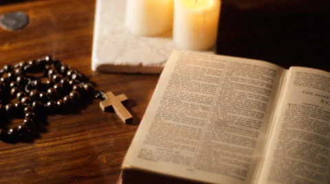 Pan from crucifix to Bible Stock Footage 36204077
