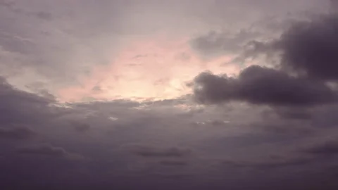 Pan dark ominous storm clouds, dark grey and pink Stock Footage 195694562