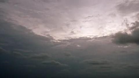 Pan dark ominous storm clouds, dark grey and pink Stock Footage 195695743