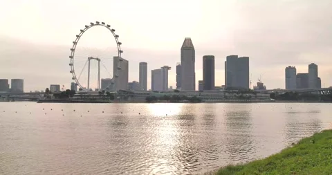 Pan day view of Flyer wheel Singapore Stock Footage 157540765