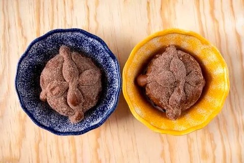 Pan de Muerto, Bread of Dead traditional Mexican sugar scone and dishes. Stock Photos
