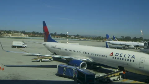 Pan to Delta Airplane at Gate Stock Footage 141744262