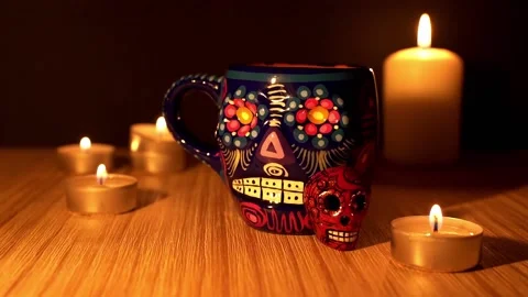 Pan of dia de los muertos or day of the dead mexican sugar skulls with candles Stock Footage 211471953