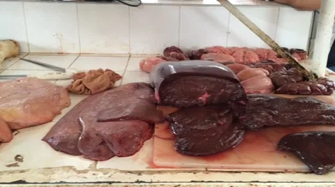 Pan of different meats and poultry on top of counter Stock Footage 62488707