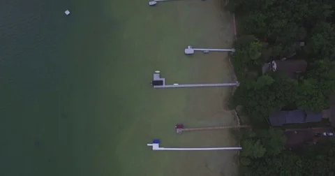 Pan up From Docks Over Lake Stock Footage 79375981