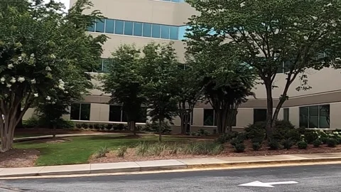 Pan of doctors standing outside at Emory Hospital Stock Footage 157997221