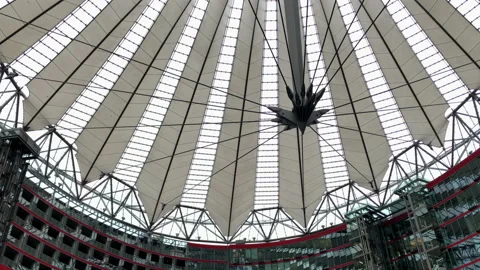 Pan from dome to main square of Sony Center in Potsdamer Platz Stock Footage 143310274
