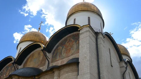 Pan from Dormition Cathedral to Ivan the Great Bell Tower with a blue sky Stock Footage 99257502