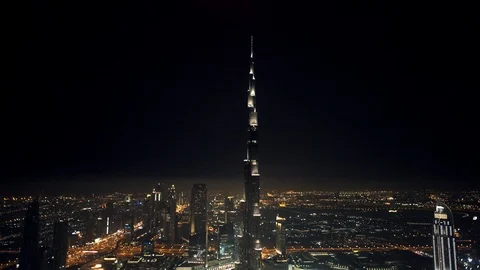 Pan down at 300m from over Business Bay. Burj Khalifa then revealing Downtown Stock Footage 98976253