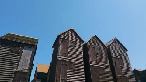 Pan Down From Blue Sky to Hastings Net Shops, Copy Space Above Stock Footage 340603771